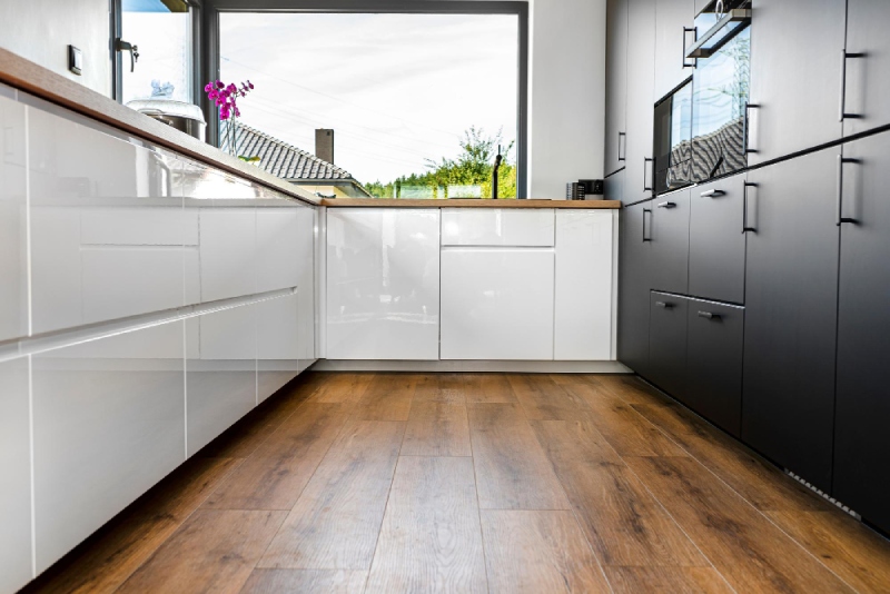 laminate vs luxury vinyl plank in a kitchen | Moore Flooring + Design laminate-vs-luxury-vinyl-plank-in-a-kitchen